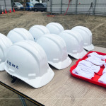 每一頂安全帽象徵著對施工安全的重視，也代表著工程團隊即將共同投入的責任與使命。